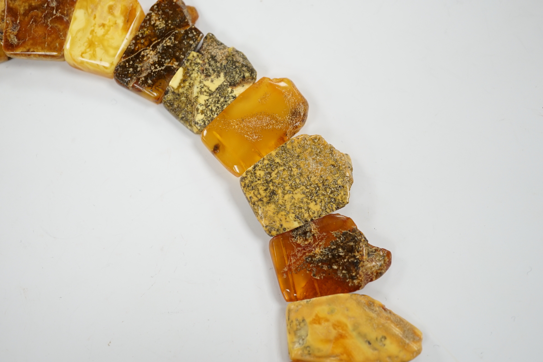 A contemporary Baltic amber fringe necklace, 46cm, gross weight 72 grams.